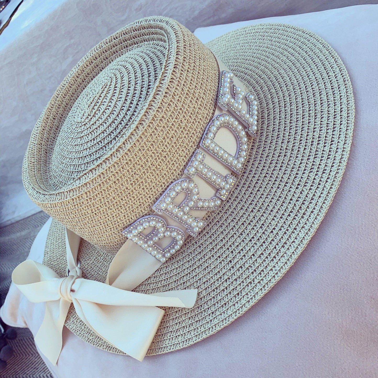 Straw bride hat with embellished pearl lettering