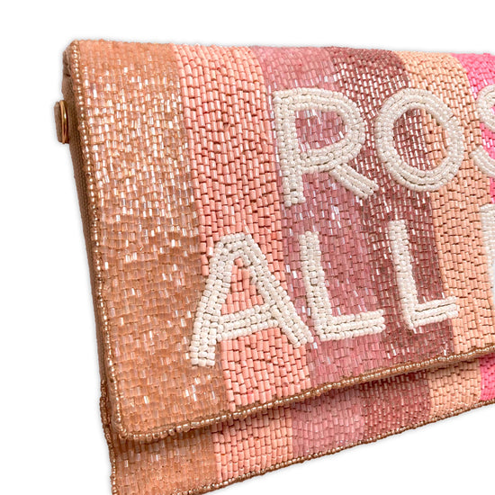 Clutch bag embellished with beads and rose all day lettering