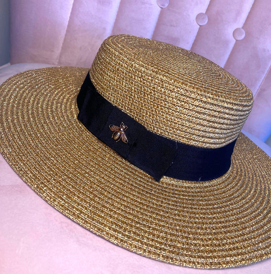 Straw Summer Hat with a gold, shiny Bee and Black Ribbon