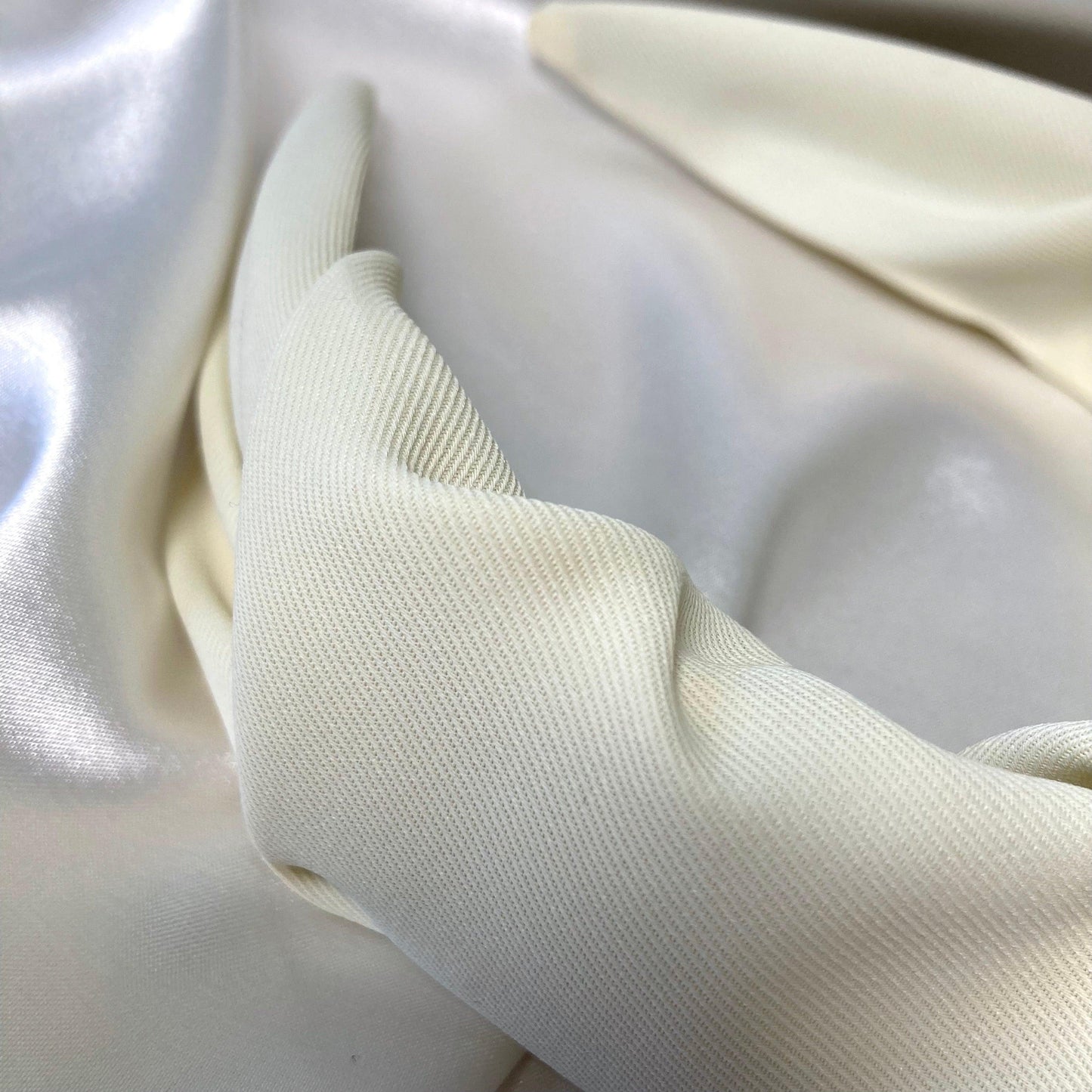 A close up of the premium cream / ivory material on the headband