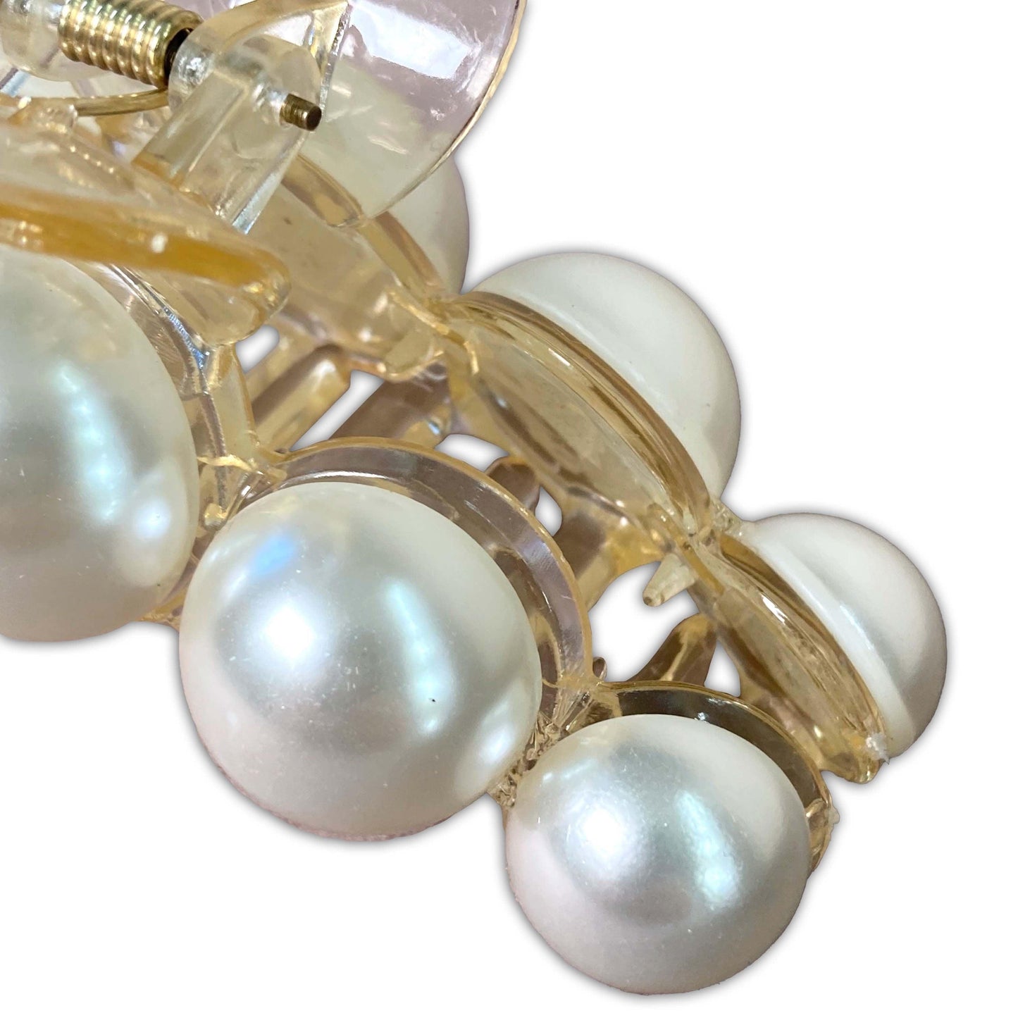 Luxury pearl embellished hair clip close up of the reflective pearls