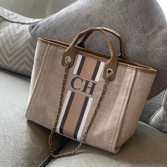 personalised tote bag with initials and PU leather handles for a suede effect.